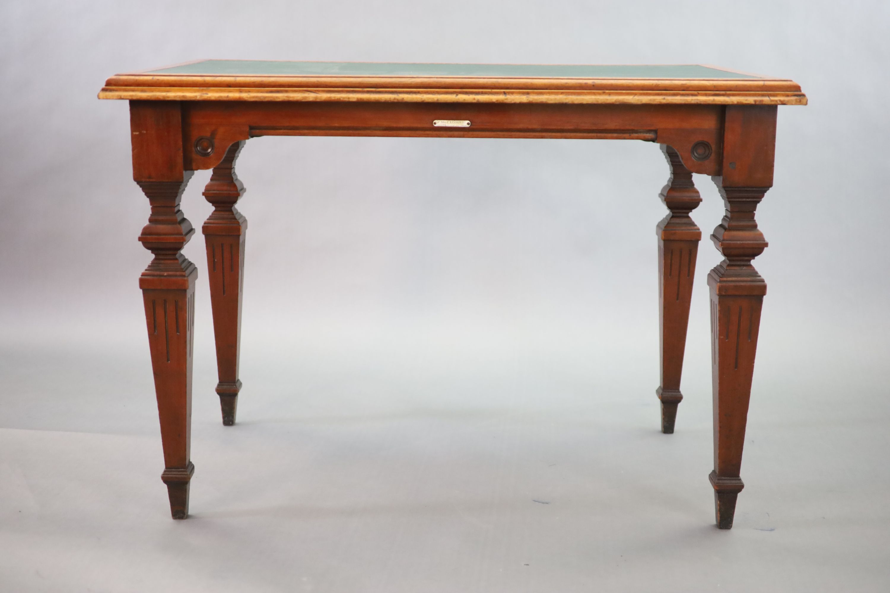 A Victorian mahogany library table, supplied by Sage & Co. Shopfitters of London, W.113cm D.69cm H.78cm